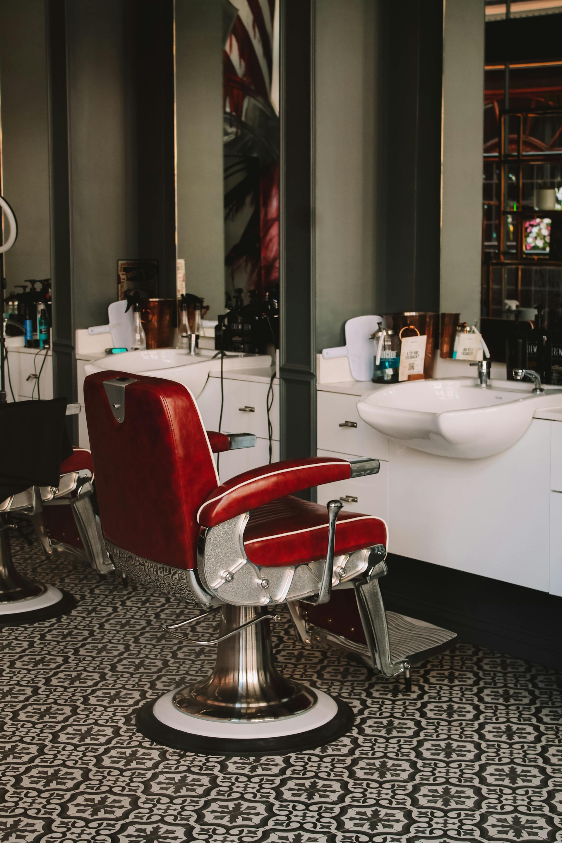 Vintage red leather barber chair under warm light