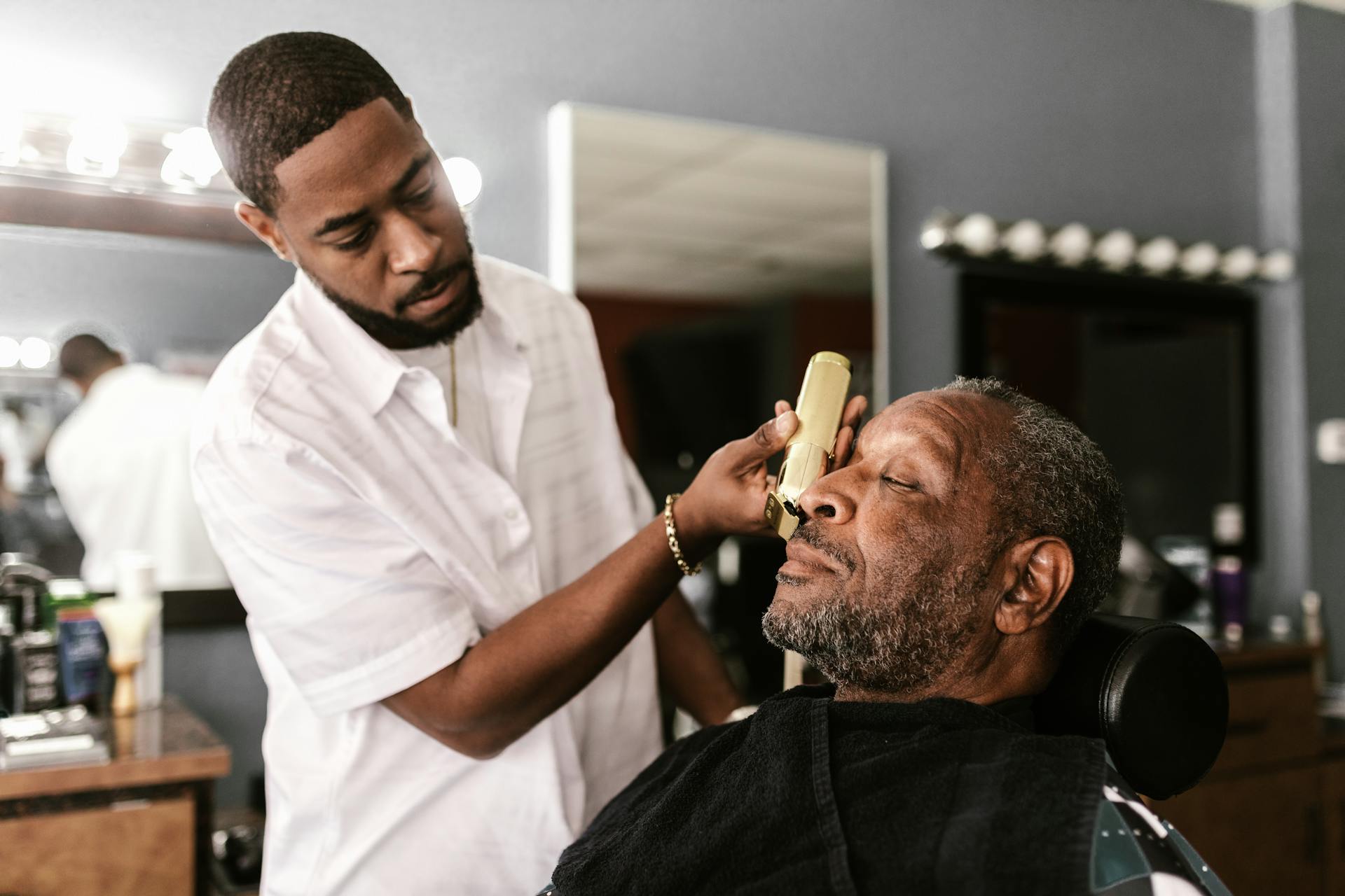 Barber's hands at work on a client